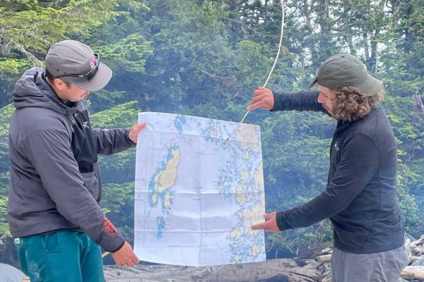 Group planning navigation on kayaking tour