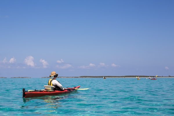 Kayaker resting in the ocean in the Bahamas